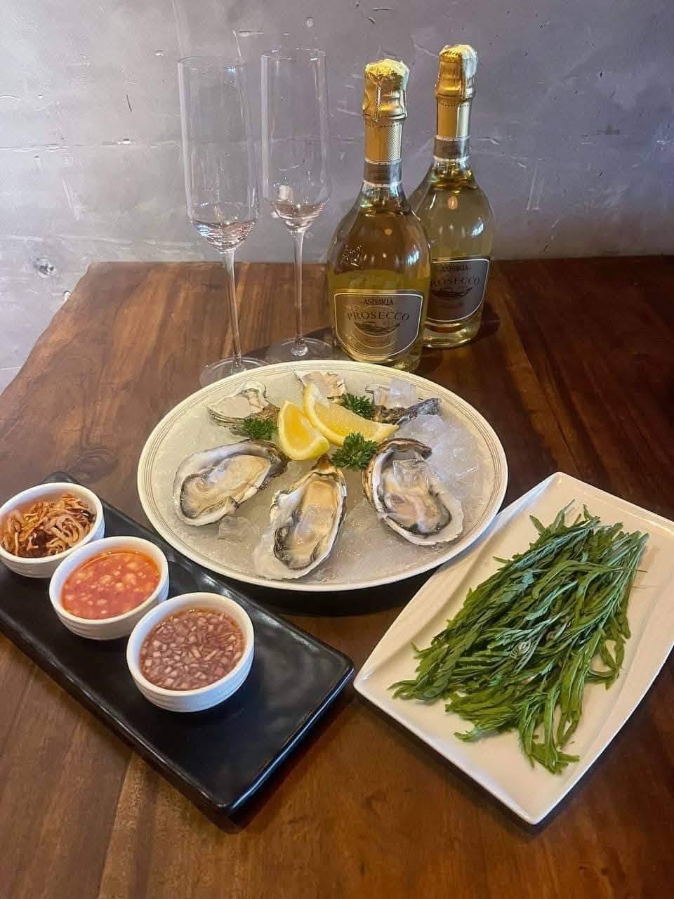 seafood platter with oysters and dipping sauces