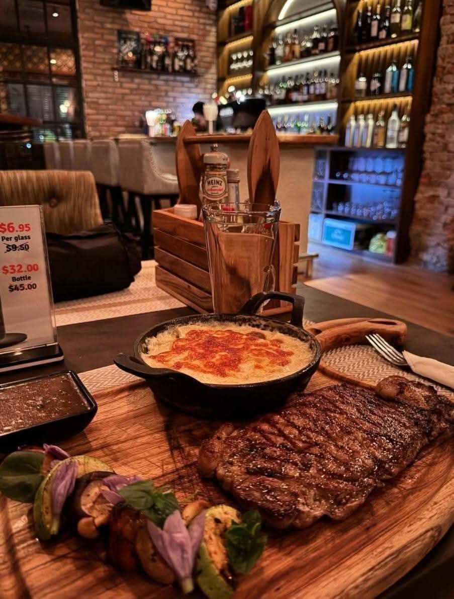 grilled steak with cheesy gratin and vegetables